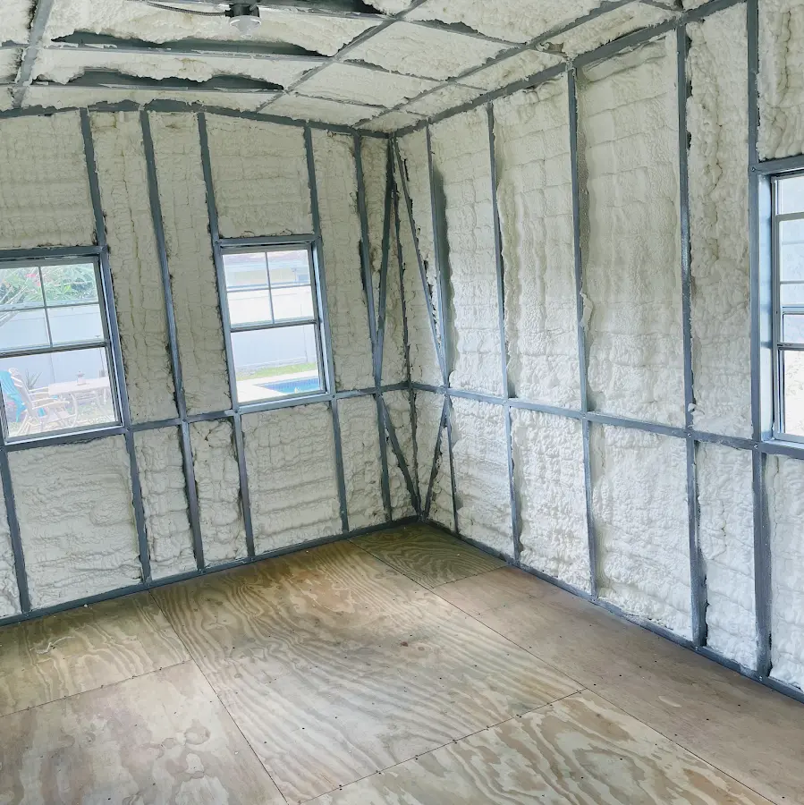 Closed-cell spray foam insulation applied to wall cavities in a residential project in Midway City